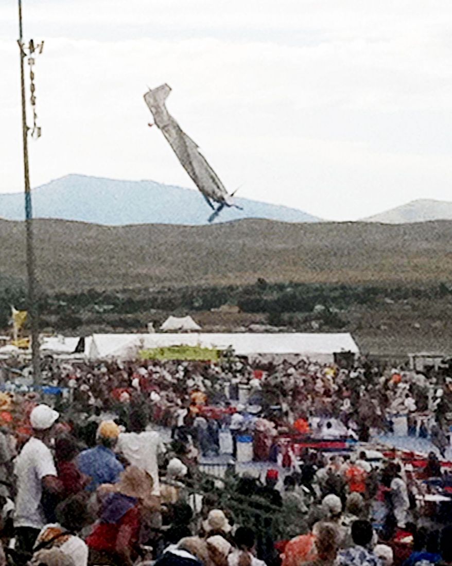 A P-51 Mustang airplane piloted by Jimmy Leeward plunges toward spectators Sept. 16 at the National Championship Air Races. The plane had climbed, rolled and then abruptly plunged nose-first into spectators. Eleven people were killed and more than 70 hurt. (Associated Press)