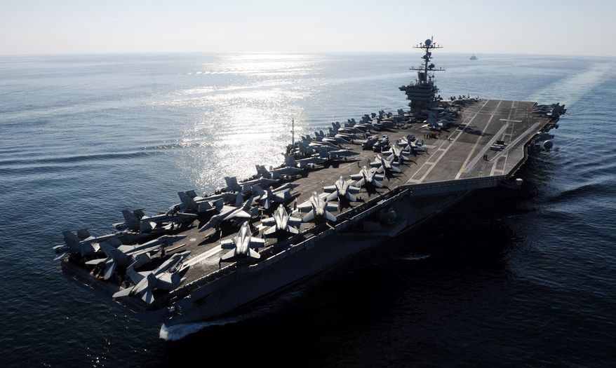 The Nimitz-class aircraft carrier USS John C. Stennis transits the Straits of Hormuz on Saturday, Nov. 12, 2011. (AP Photo/U.S. Navy, Petty Officer 3rd Class Kenneth Abbate)