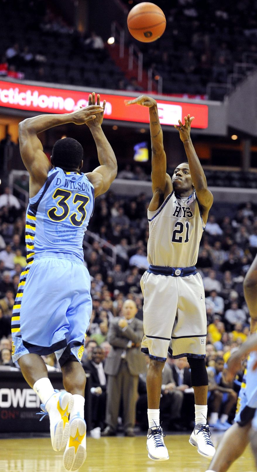 Guard Jason Clark led all scorers with 26 points as No. 9 Georgetown wiped out a 17-point second-half deficit to defeat No. 20 Marquette on Wednesday. (Associated Press)