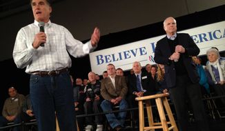 Former Massachusetts Gov. Mitt Romney (left), accompanied by Sen. John McCain, Arizona Republican, campaigns for the GOP presidential nomination at the Boys and Girls Club in Salem, N.H., on Thursday, Jan. 5, 2012. (AP Photo/Charles Dharapak)