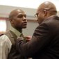 **FILE** Boxer Floyd Mayweather Jr. (left) has his tie adjusted by his manager Leonard Ellerbe on Dec. 21, 2011, while waiting for sentencing in Clark County District Court in Las Vegas. Mayweather was sentenced to 90 days in jail after pleading guilty to reduced battery domestic violence and harassment charges. (Associated Press)