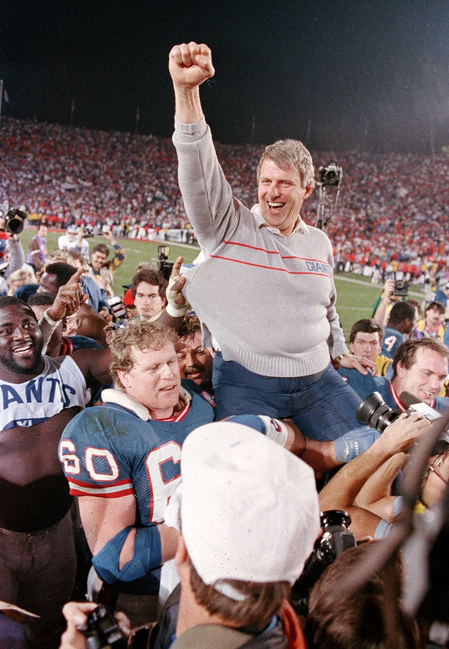 FILE - In this Jan. 25, 1987, file photo, New York Giants coach Bill Parcells is carried off the field after the Giants defeated the Denver Broncos 39-20 in SuperBowl XXI NFL football game in Pasadena, Calif. Parcells moved one step closer to Canton on Saturday, Jan. 7, 2012, when the Pro Football Hall of Fame released a list of 15 modern-era finalists for enshrinement that included the Super Bowl-winning coach. (AP Photo/Eric Risberg, File)