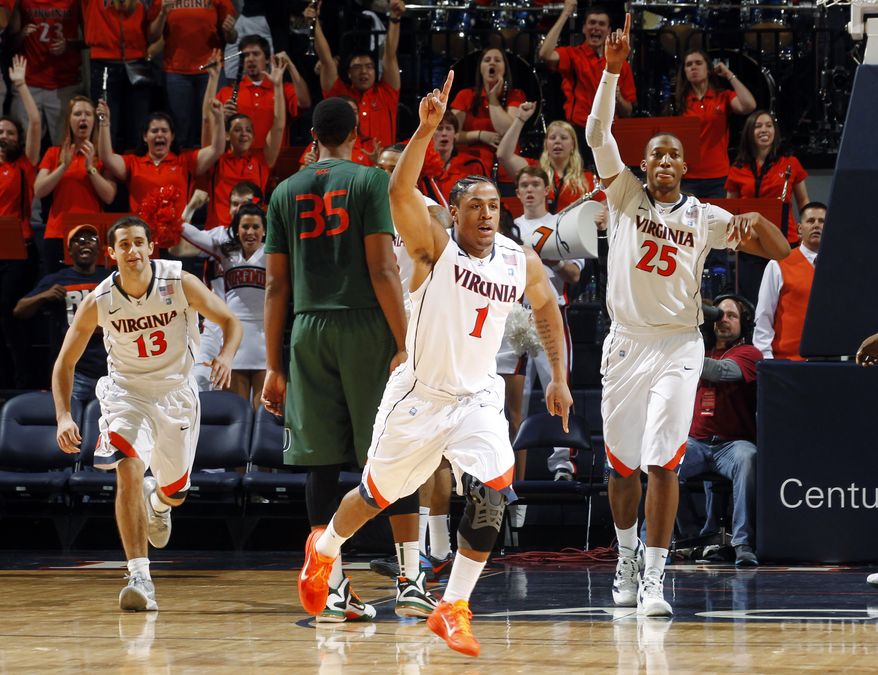 Virginia celebrates as the clock expires at the end of their 52-51 win against Miami, Saturday, Jan. 7, 2012, in Charlottesville, Va. (AP Photo/Andrew Shurtleff)