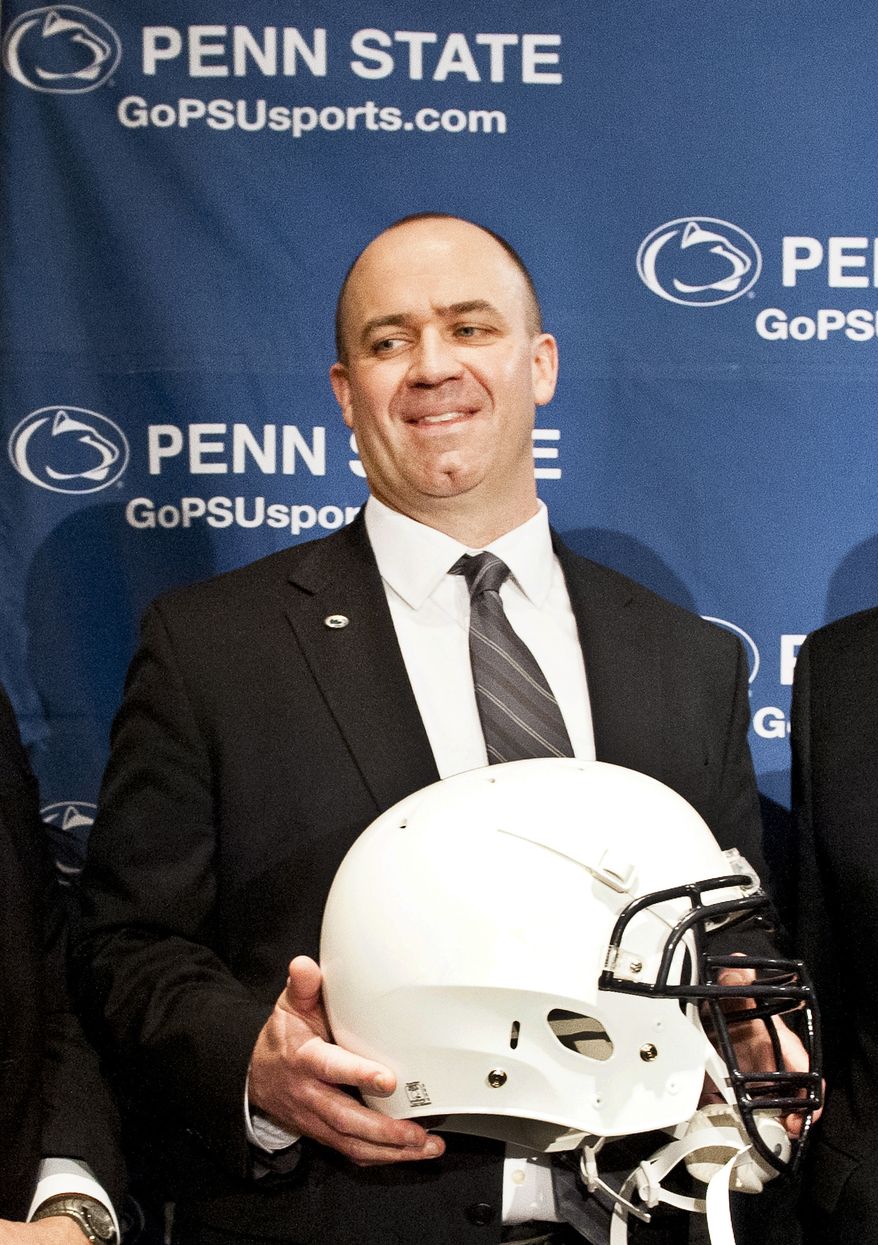 Penn State's new football coach Bill O'Brien holds Penn State football helmet after he was introduced during an NCAA college football news conference, Saturday, Jan. 7, 2012, in State College, Pa. O'Brien, who is currently the offensive coordinator for the New England Patriots, replaces Hall of Famer Joe Paterno, fired Nov. 9 in the aftermath of child sex abuse charges against retired assistant coach Jerry Sandusky. (AP Photo/Andy Colwell)