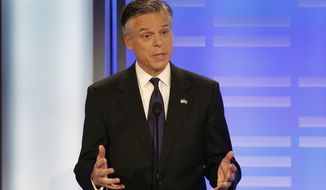 Former Utah Gov. Jon Huntsman answers a question during a Republican presidential debate at St. Anselm College in Manchester, N.H., on Saturday, Jan. 7, 2012. (AP Photo/Elise Amendola)