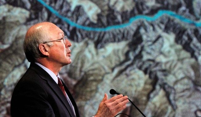 ** FILE ** Interior Secretary Kenneth L. Salazar stands in front of a map of the Grand Canyon as he announces a 20-year ban on new mining claims. (Associated Press)