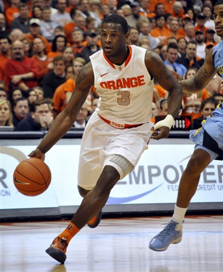 Syracuse's Dion Waiters drives against Marquette during the second half in Syracuse, N.Y., Saturday, Jan. 7, 2012. (AP Photo/Kevin Rivoli)