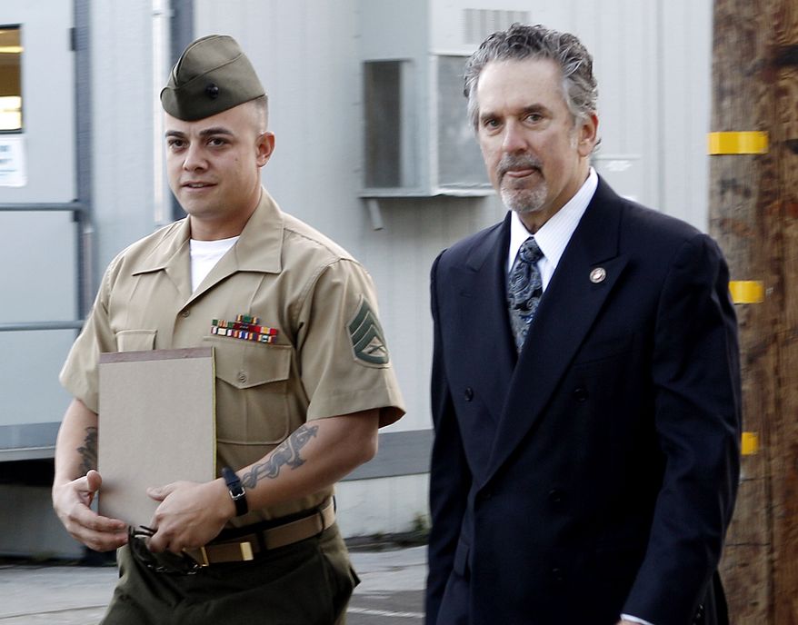 ** FILE ** Marine Staff Sgt. Frank Wuterich (left) arrives at court at Camp Pendleton, Calif., with lead defense lawyer Neal Puckett on Thursday, Jan. 5, 2012. (AP Photo/Lenny Ignelzi, File)