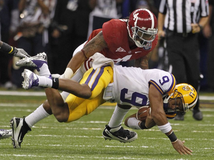 LSU quarterback Jordan Jefferson (9) is tackled by Alabama's Mark Barron during the second half of the BCS National Championship college football game Monday, Jan. 9, 2012, in New Orleans. (AP Photo/Dave Martin)