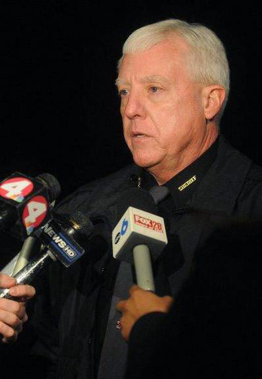 Hocking County Sheriff Lanny North talks to reporters late Monday night, Jan. 9, 2012, after a family dispute ended when a man apparently shot and killed his wife's two sisters and his son before fatally shooting himself in Logan, Ohio. (AP Photo/The Eagle-Gazette, Jess Lanning)