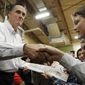 Former Massachusetts Gov. Mitt Romney campaigns for the Republican presidential nomination at McKelvie Intermediate School in Bedford, N.H., on Monday, Jan. 9, 2012. (AP Photo/Charles Dharapak)
