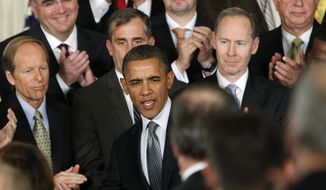 President Obama, accompanied by leaders from the private sector and the government, speaks in the East Room of the White House in Washington on Wednesday, Jan. 11, 2012, to encourage companies to insource and invest in America. (AP Photo/Manuel Balce Ceneta)
