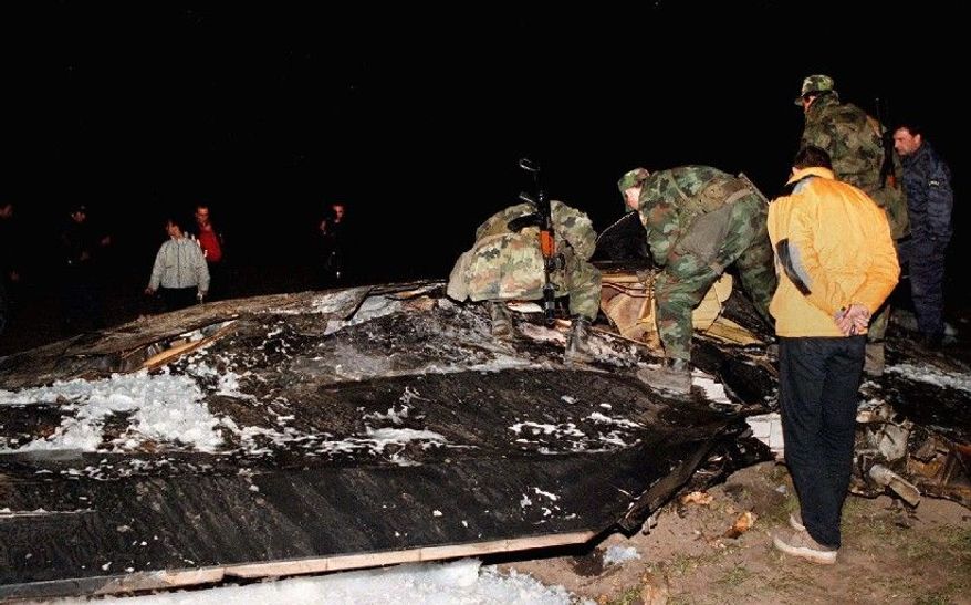 Serbian army soldiers check the wreckage of a USAF F-117 stealth fighter after it crashed near Budjanovic, 30 miles northwest of Belgrade, in 1999. (Associated Press)