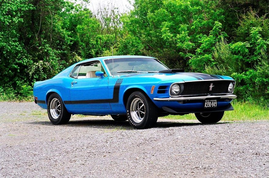 "Boss 302" in black trim on the front fender, the chin spoiler and a shaker hood makes a hot Mustang.