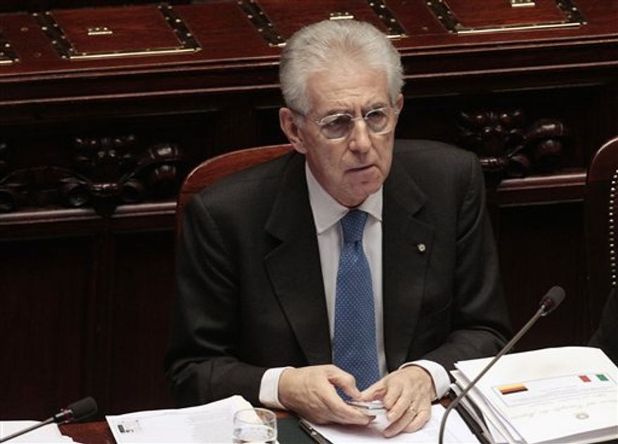 Italian Premier Mario Monti attends a debate at the lower chamber in Rome, Thursday, Jan. 12, 2012. Monti says he would support a new tax on financial transactions so long as it applies to the European Union as a whole. Speaking after meeting Wednesday with German Chancellor Angela Merkel, Monti indicated his preference for such a tax for the whole 27-nation bloc, rather than just the 17 countries that use the euro as their currency. (AP Photo/Gregorio Borgia)