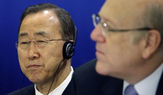 U.N. Secretary-General Ban Ki-moon (left) and Lebanese Prime Minister Najib Mikati attend the opening session of a conference on democracy in the Arab world in Beirut on Sunday, Jan. 15, 2012. (AP Photo/Bilal Hussein)