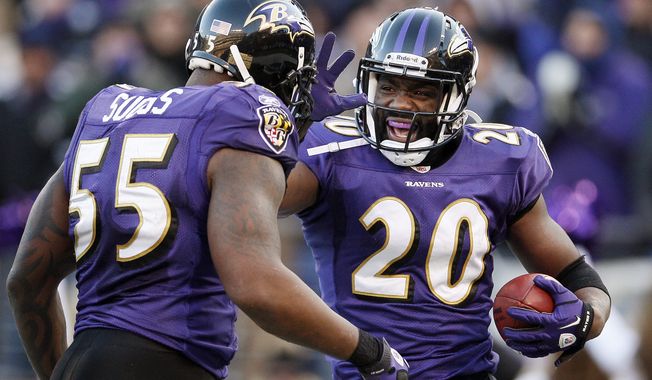 Baltimore Ravens free safety Ed Reed celebrates his interception with outside linebacker Terrell Suggs during the second half of a divisional playoff football game against the Houston Texans in Baltimore, Sunday, Jan. 15, 2012. The Ravens won the game 20-13. (AP Photo/Patrick Semansky)