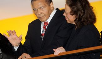 Muhammad Ali, with his wife, Lonnie, waves to friends at a party for his 70th birthday at the Muhammad Ali Center in his hometown, Louisville, Ky., on Saturday, Jan. 14, 2012. The event, a fundraiser for the center, was the first of five planned in his honor. (Associated Press)
