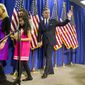 Former Utah Gov. Jon Huntsman walks off stage with his family Jan. 16, 2012, after announcing the withdrawal of his presidential candidacy in Myrtle Beach, S.C. From left are wife Mary Kaye and daughters Gracie and Abby. (Associated Press)