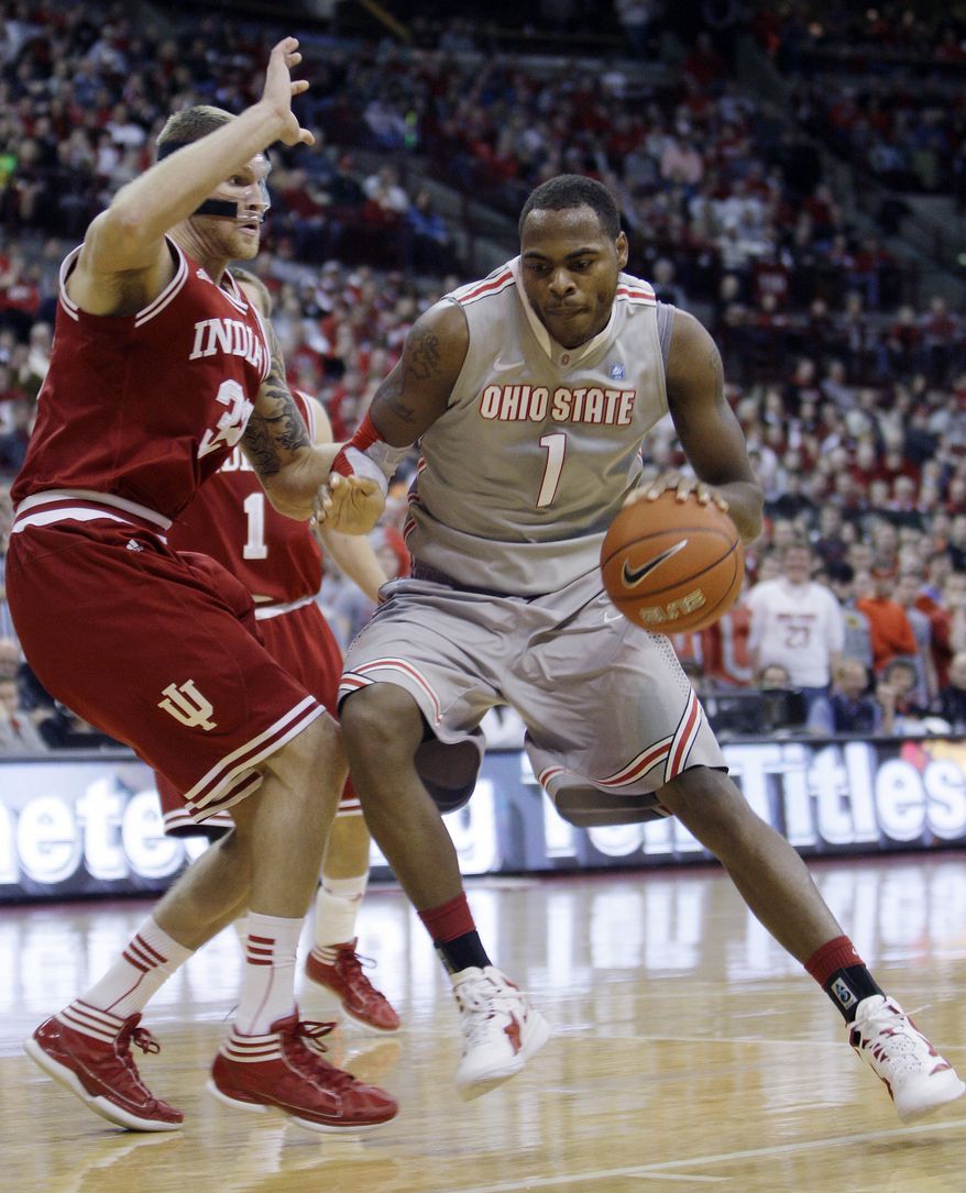 Ohio State's Deshaun Thomas, right, drives to the basket against Indiana's Derek Elston during the second half of an NCAA basketball game Sunday, Jan. 15, 2012, in Columbus, Ohio. Ohio State beat Indiana 80-63. (AP Photo/Jay LaPrete)
