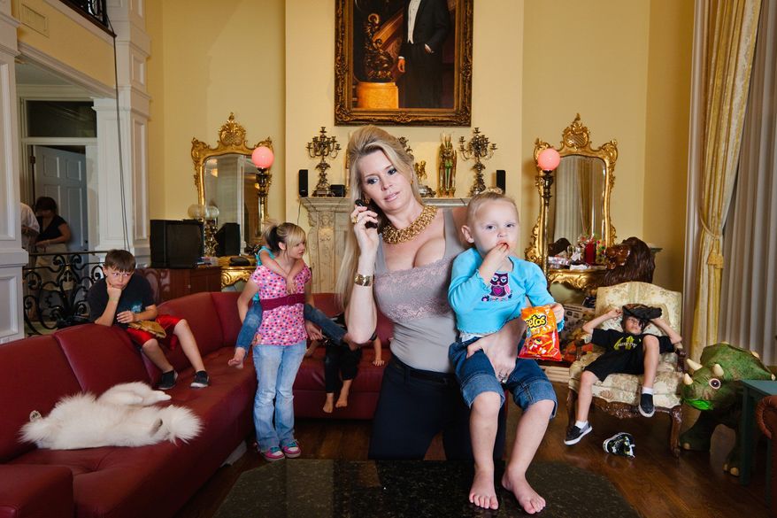 Jackie Siegel is shown with her children during the filming of "The Queen of Versailles," Lauren Greenfield's U.S. documentary that examines the housing boom-and-bust story of a couple trying to build a palatial 90,000-square-foot mansion. The film will be shown at the Sundance Film Festival. (Associated Press)