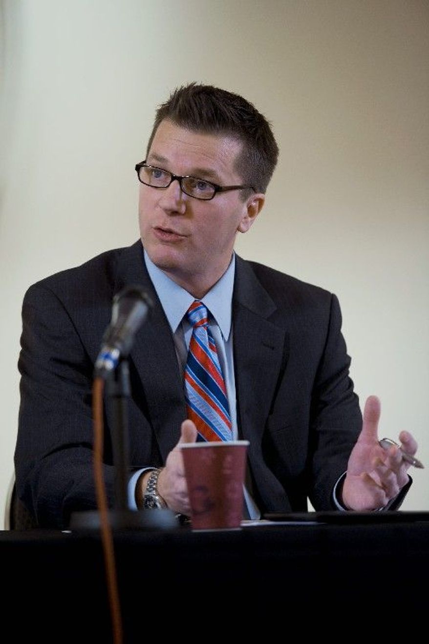 John A. Purcell, vice president of wind energy for Leeco Steel, makes a point about wind power in an interview Tuesday with the editorial staff of The Washington Times. "It is truly an American success story," he says. (Barbara L. Salisbury/The Washington Times)