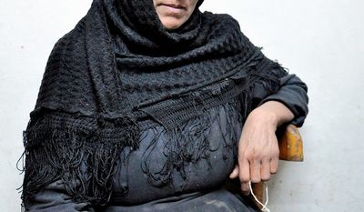UNDER SIEGE: Mona Hanna says she fears for the future of her town, Abo Korkas, Egypt. She and nine other families fled their homes last year after armed Muslim men set her house afire. (Sarah Lynch/Special to The Washington Times)