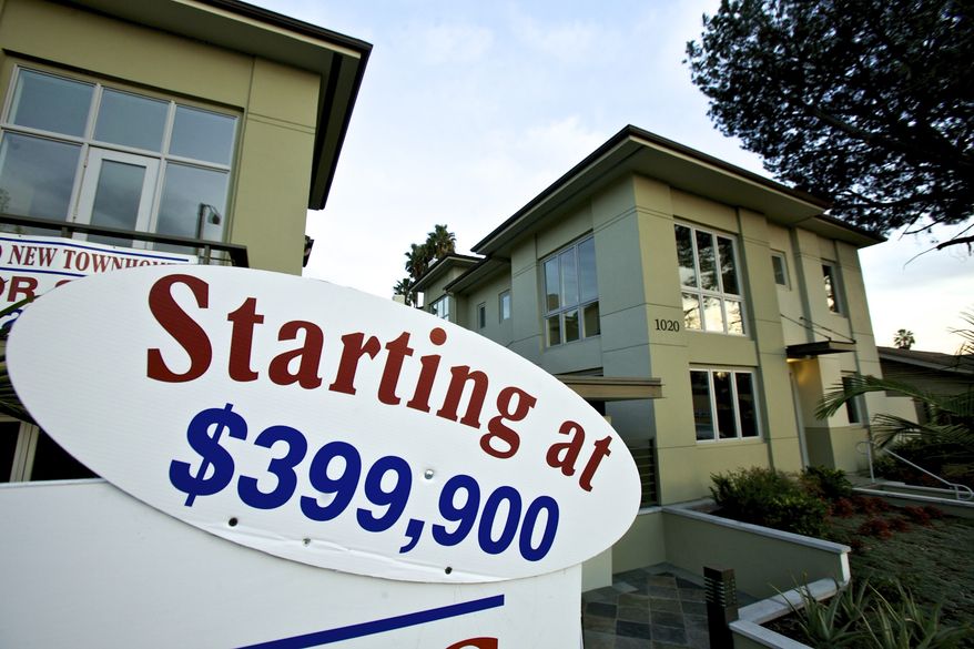 **FILE** Newly built luxury townhomes are offered for sale Jan. 10, 2012, in Woodland Hills, Calif. (Associated Press)