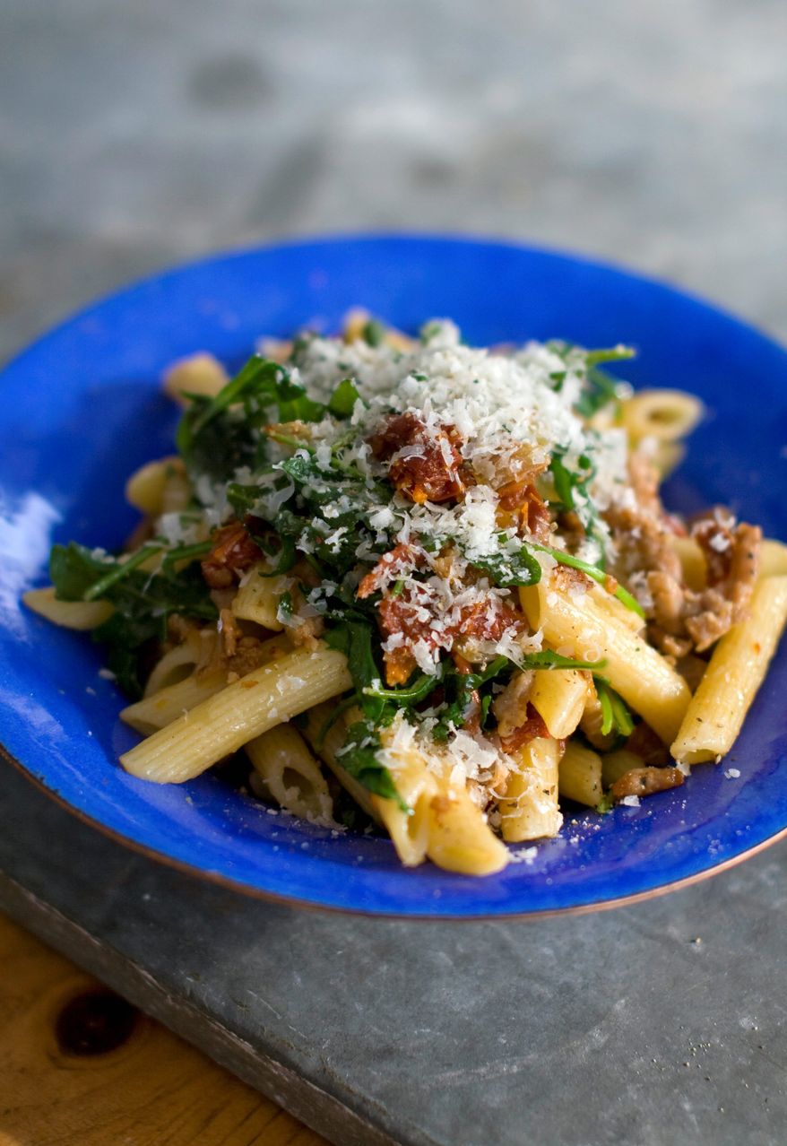 Sausage and arugula penne is an example of a fantastic dinner that can be made quickly with a few ingredients from the pantry and the grocery store. The trick is to pick ingredients with tons of flavor. (Associated Press)
