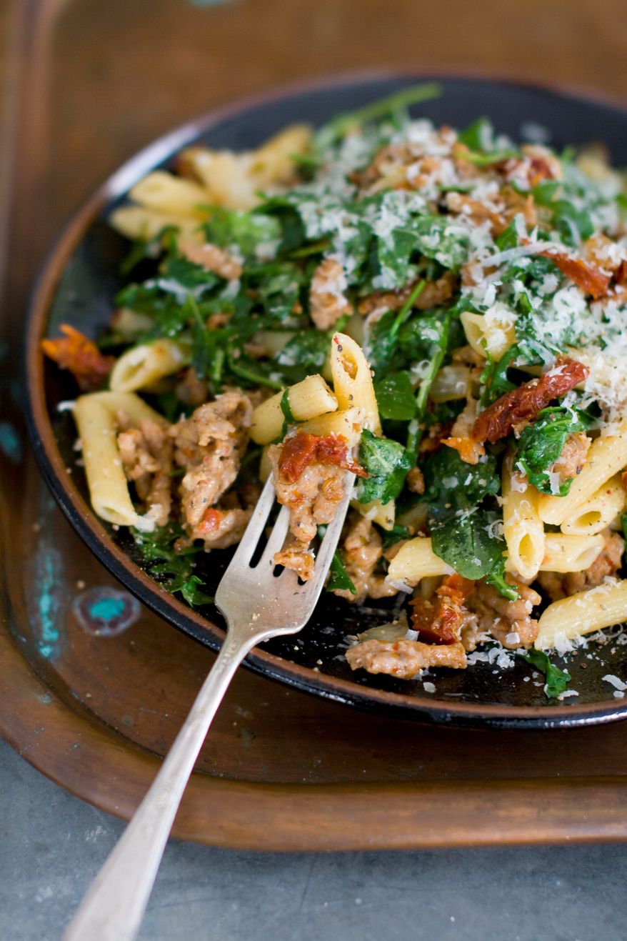 Sausage and arugula penne is an example of a fantastic dinner that can be made quickly with a few ingredients from the pantry and the grocery store. The trick is to pick ingredients with tons of flavor. (Associated Press)