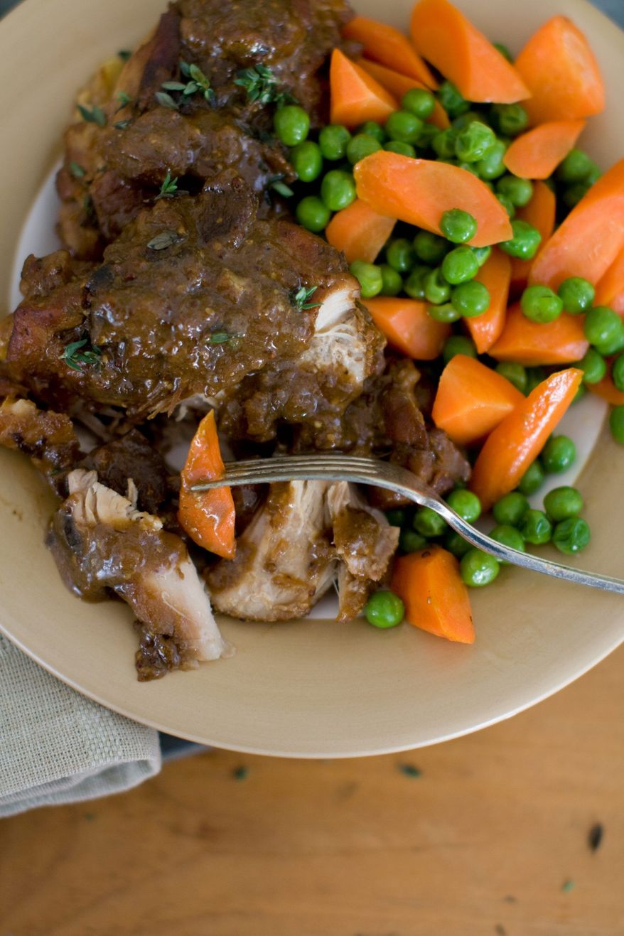 Cookbook author Rocco DiSpirito serves up his braised chicken with mushrooms and mustard, perfect for a hearty winter meal. It can be made in a slow cooker or in the oven. (Associated Press)