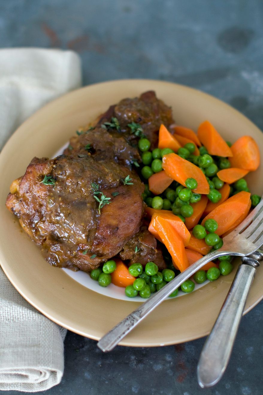Cookbook author Rocco DiSpirito serves up his braised chicken with mushrooms and mustard, perfect for a hearty winter meal. It can be made in a slow cooker or in the oven. (Associated Press)