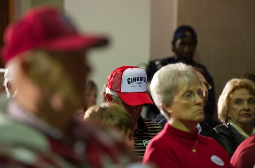 Supporters of Republican presidential candidate and former House Speaker Newt Gingrich listen as he addresses a town hall meeting Jan. 20, 2012, at the Cinema Room in Orangeburg, S.C. (Andrew Harnik/The Washington Times)