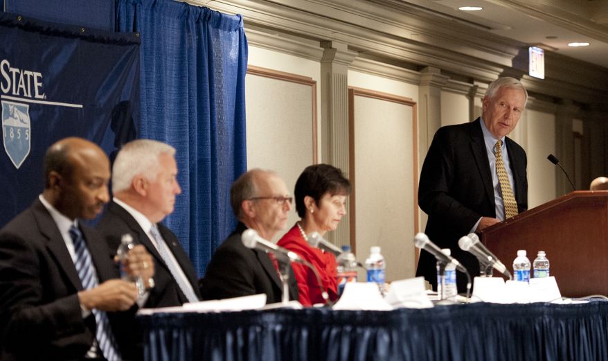 Penn State President Rodney Erickson, at far right, introduces members of the Board of Trustees available for media questions following the regularly scheduled Penn State Board of Trustees meeting in State College, Pa., Friday, Jan. 20, 2012. Seated at the table from left to right are trustee Kenneth Frazier, trustee and Pennsylvania Governor Tom Corbett, board vice chair Keith Masser and board president Karen Peetz. Erickson had used the board meeting as an opportunity to try to address the perception that the university isn't being as open and honest as it could be in the wake of the Jerry Sandusky scandal. (AP Photo/Andy Colwell)
