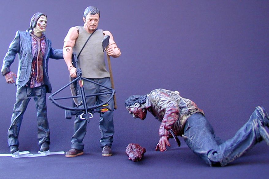 McFarlane Toys' Daryl Dixon gets ready to take care of the Zombie Biter while the Zombie Walker sneaks up on him. (Photograph by Joseph Szadkowski / The Washington Times)