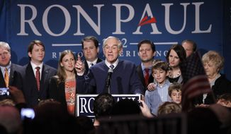 ** FILE ** Republican presidential candidate Rep. Ron Paul, R-Texas, center, is joined on stage with members of his family during his South Carolina presidential primary election night rally in Columbia, S.C., Saturday, Jan., 21, 2012. Former House Speaker Newt Gingrich won the Republican primary that night. (AP Photo/Pablo Martinez Monsivais)