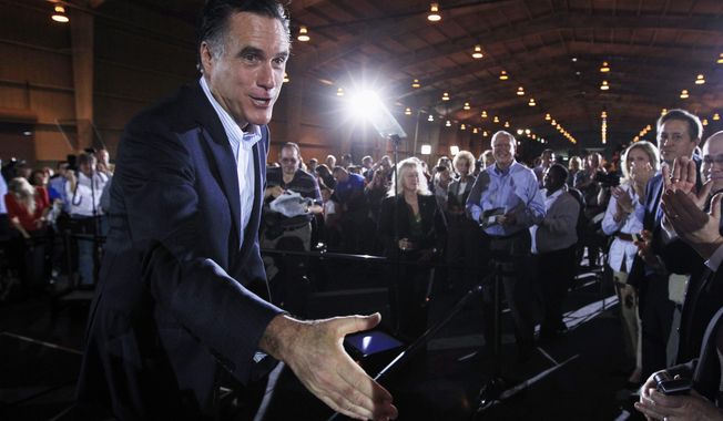 Republican presidential candidate, former Massachusetts Gov. Mitt Romney, greets audience members after speaking at the National Gypsum Company in Tampa, Fla., Tuesday, Jan. 24, 2012. (AP Photo/Charles Dharapak)