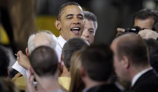 President Obama is greeted Jan. 25, 2012, at the Conveyor Engineering &amp; Manufacturing plant in Cedar Rapids, Iowa, after speaking about manufacturing jobs. (Associated Press)