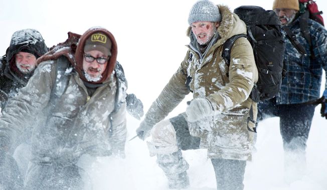 Dallas Roberts (from left), Dermot Mulroney, Liam Neeson and Nonso Anozie star in "The Grey," a story about beastly challenges of survival. (Associated Press)