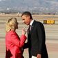 Arizona Gov. Jan Brewer makes a point to President Obama upon his arrival Wednesday at Phoenix-Mesa Gateway Airport. Mrs. Brewer said he took issue with a passage in her book that described an encounter in an unflattering manner. (Associated Press)