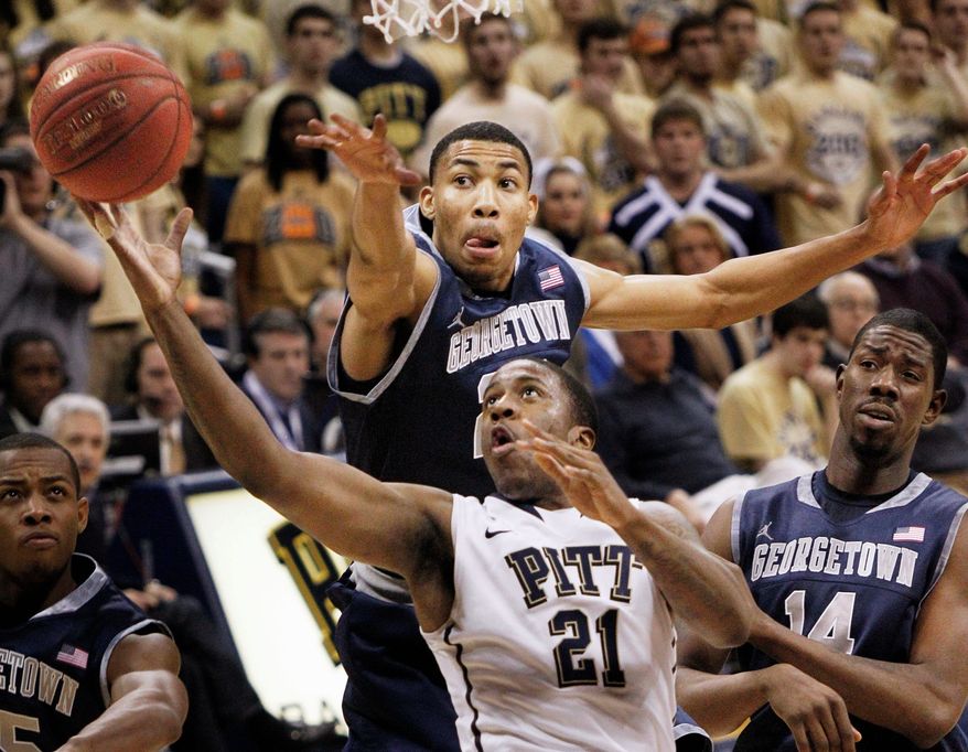 ASSOCIATED PRESS
Pittsburgh's Lamar Patterson drives past Georgetown's Otto Porter (top) and Henry Sims during the first half of the Panthers' 72-60 Big East victory Saturday night.