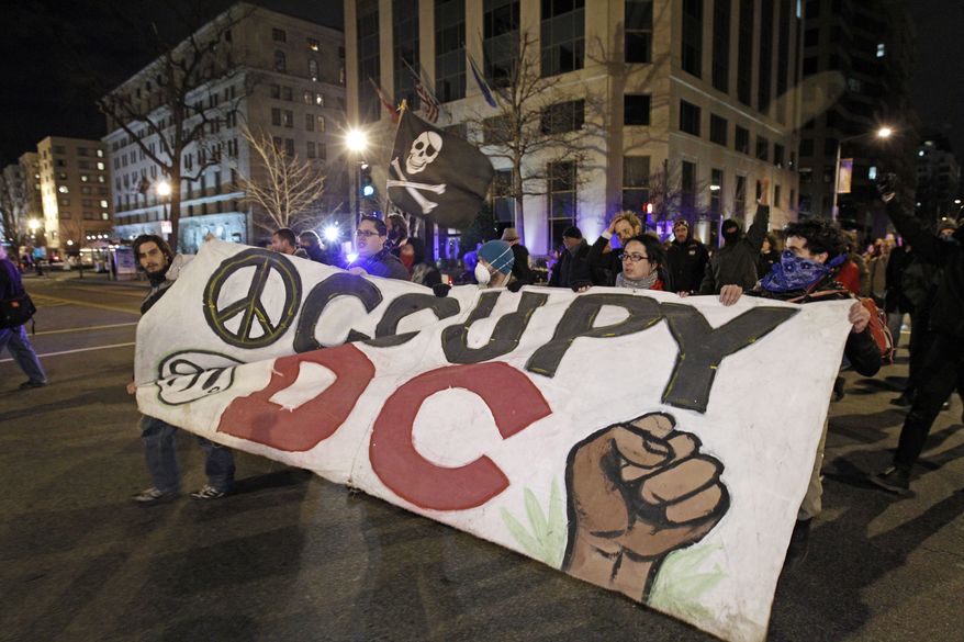 Occupy DC demonstrators protest against the Alfalfa Dinner at the Capitol Hilton in Washington on Saturday, Jan. 28, 2012. (AP Photo/Jose Luis Magana)
