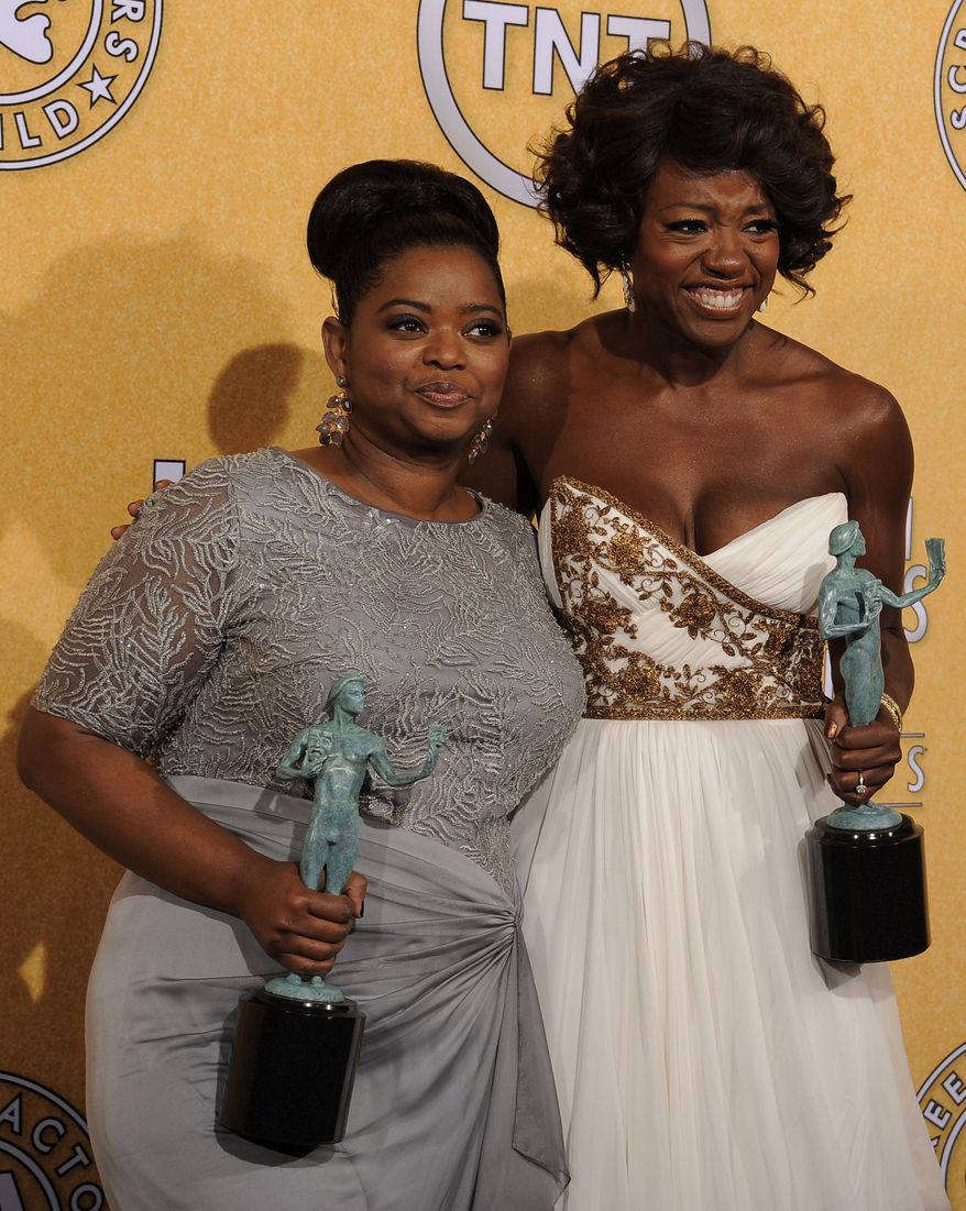 Octavia Spencer, winner of award for outstanding performance by a female actor in a supporting role for "The Help," left, and Viola Davis, winner of the award for outstanding performance by a female actor in a leading role for "The Help," pose backstage at the 18th Annual Screen Actors Guild Awards on Sunday Jan. 29, 2012 in Los Angeles. (AP Photo/Chris Pizzello)