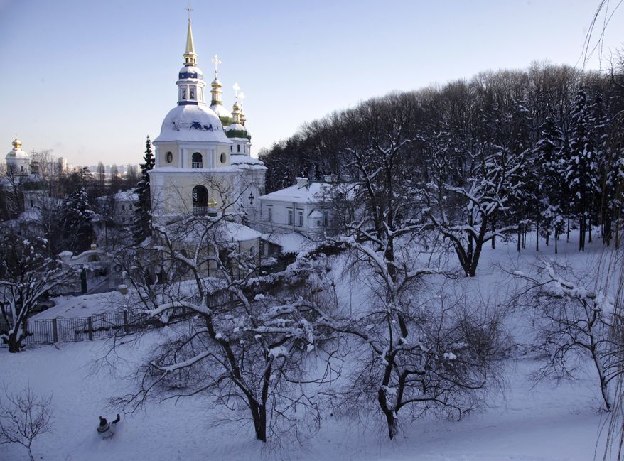 Snow surrounds an Orthodox Christian cathedral in Kiev on Monday, Jan. 30, 2012. Ukraine's Emergency Situations Ministry said 18 people had died of hypothermia and nearly 500 people had sought medical help for frostbite and hypothermia in just three days last week. (AP Photo/Efrem Lukatsky)