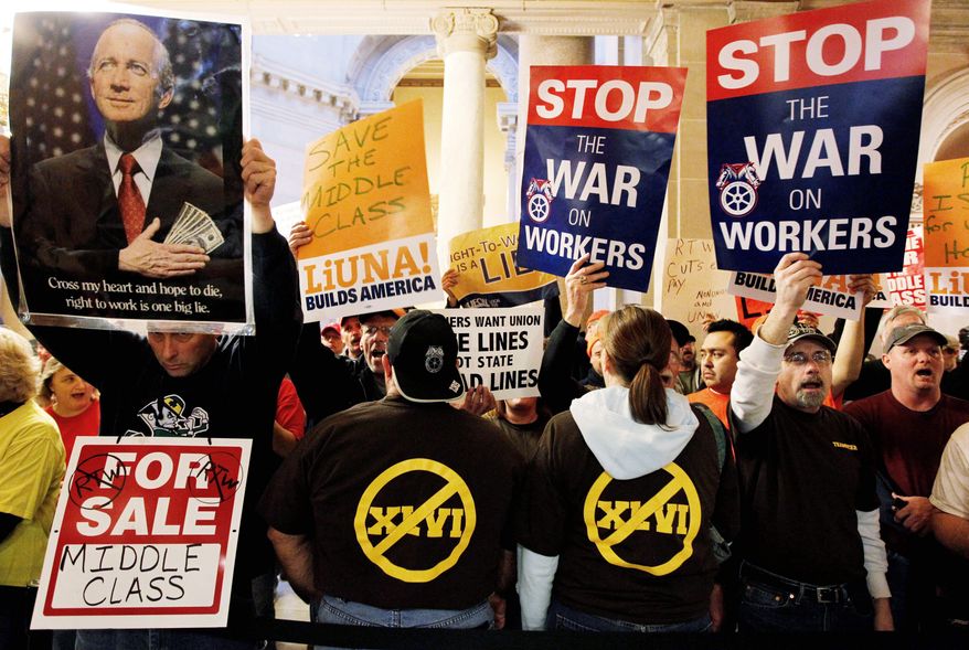 Protesters against a right-to-work bill that could pass the Indiana Senate as early as Wednesday and be signed this week gather outside the Statehouse on Jan. 19. (Associated Press)
