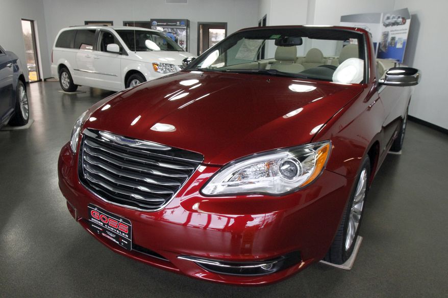 A 2012 Chrysler 200 convertible is on display in the showroom of Goss Dodge Chrysler in South Burlington, Vt., on Tuesday, Jan. 31, 2012. (AP Photo/Toby Talbot)