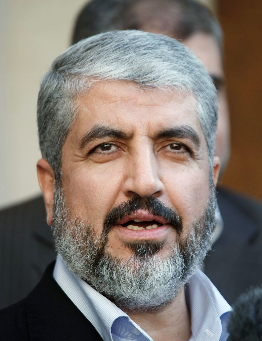 Hamas leader Khaled Mashaal (left) and Palestinian Authority President Mahmoud Abbas are scheduled to meet next week to discuss actions on a deal reached in May to end a 4 1/2-year rift between Hamas and Mr. Abbas' Fatah party. (Associated Press)