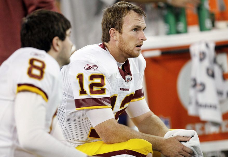 Washington Redskins quarterbacks Rex Grossman (8) and John Beck (12) sit on the bench during the second half of an NFLl game against the Buffalo Bills at the Rogers Centre in Toronto, Sunday, Oct. 30, 2011. (AP Photo/Derek Gee)