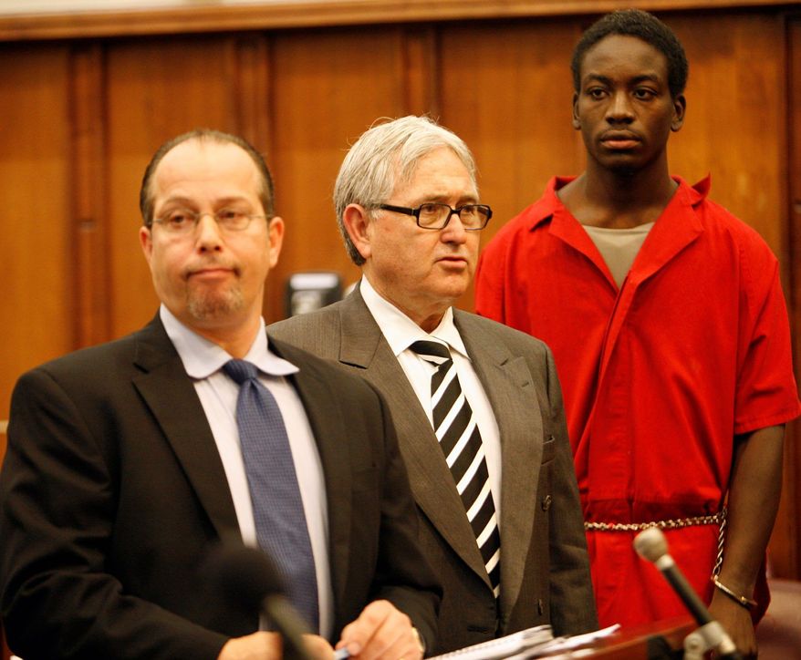 Charles Kendrick Lee (right), charged in the slaying of Washington Redskins safety Sean Taylor, is joined by attorneys David Brener (left) and Wilbur Smith in a Miami courtroom Dec. 21, 2007. (The Associated Press)