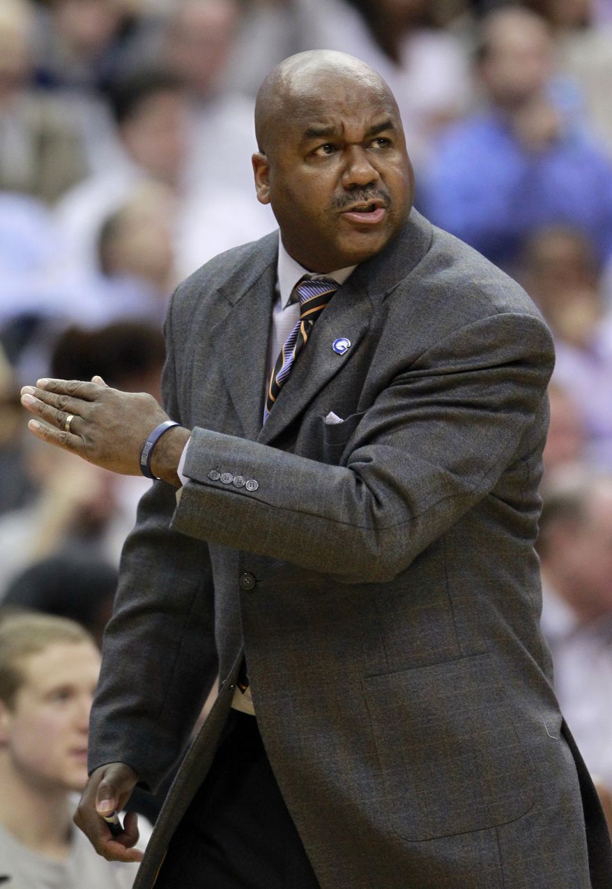 Georgetown head coach John Thompson III reacts to a play during the first half of an NCAA basketball game against Connecticut, Wednesday, Feb. 1, 2012, in Washington. (AP Photo/Haraz Ghanbari)